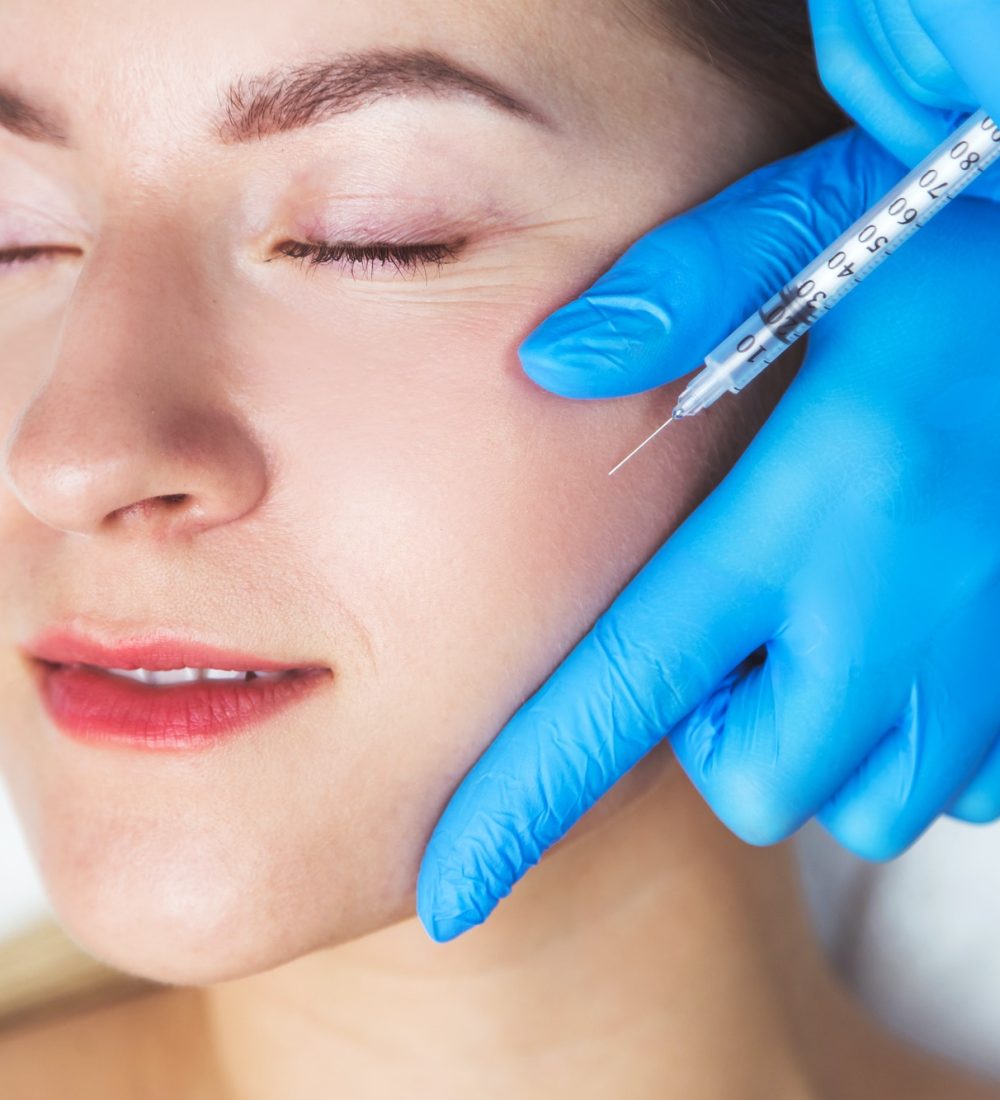 Rejuvenating facial injections procedure for tightening and smoothing wrinkles on the face skin